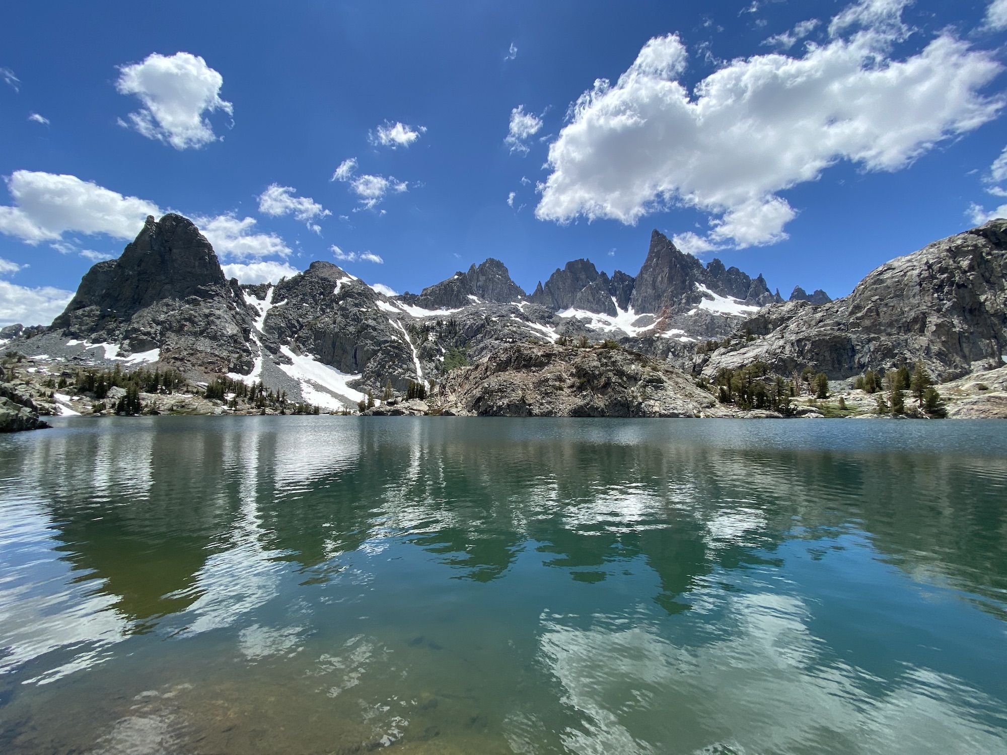 A mountain range reflecting from a lake