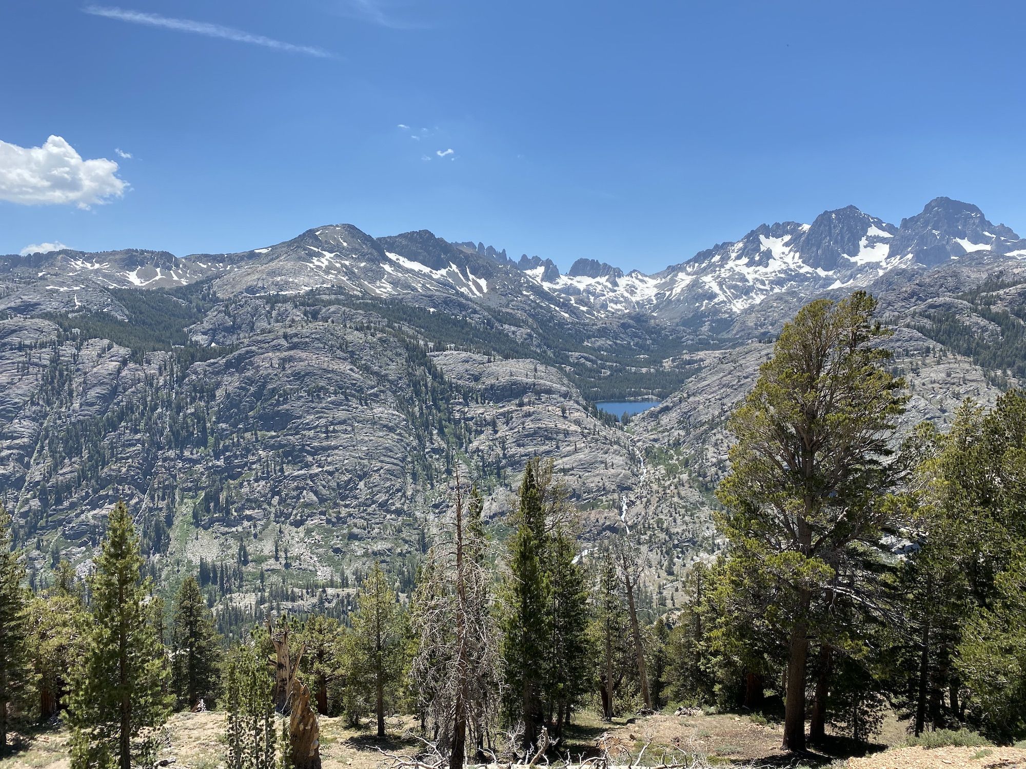 A lake and mountains in the distance