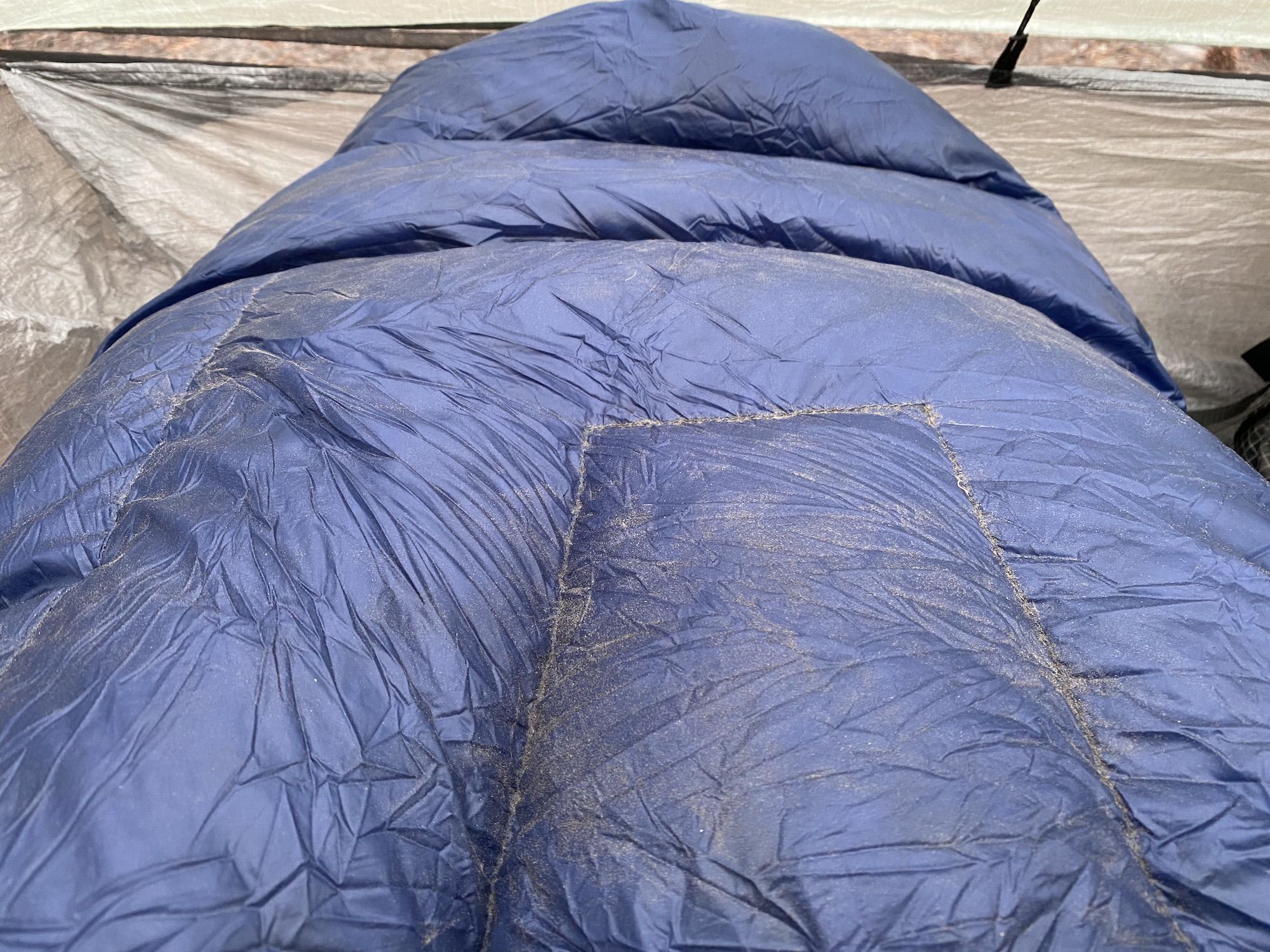 A layer of dust on a sleeping bag