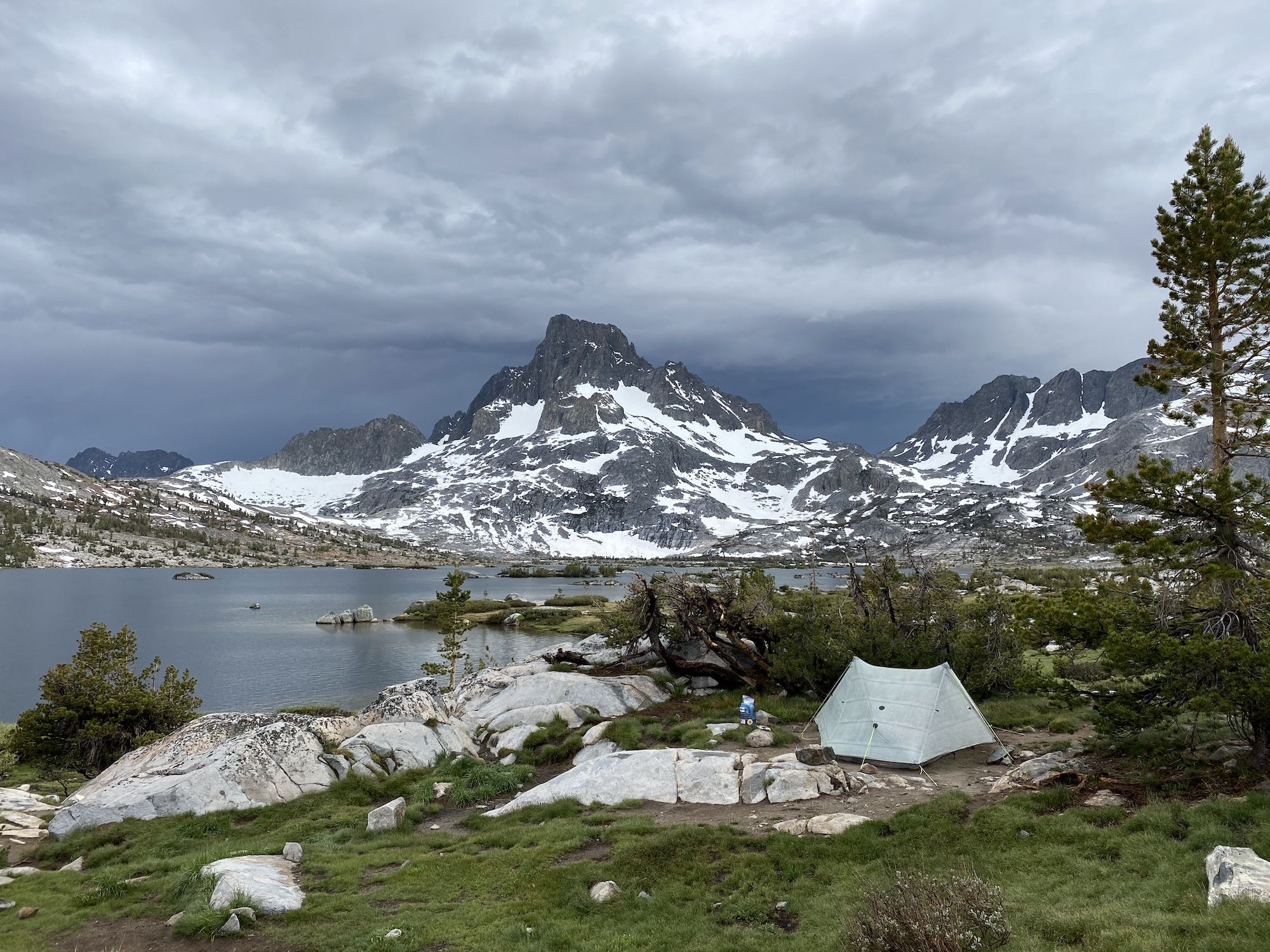 A tent behind bushes. Thousand Island Lake is one of the most popular backpacking destinations in Ansel Adams