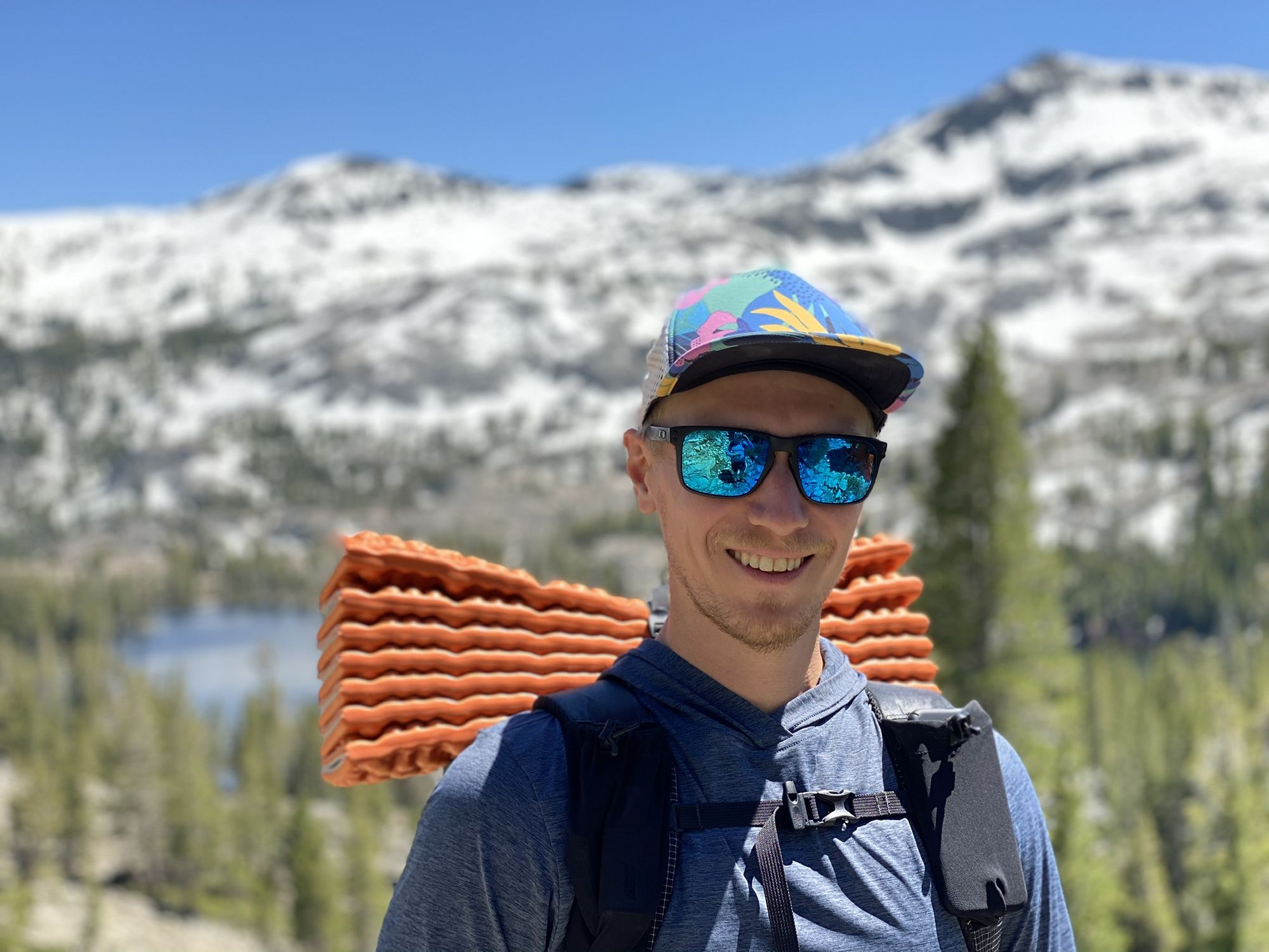 Backpacker in front of mountains