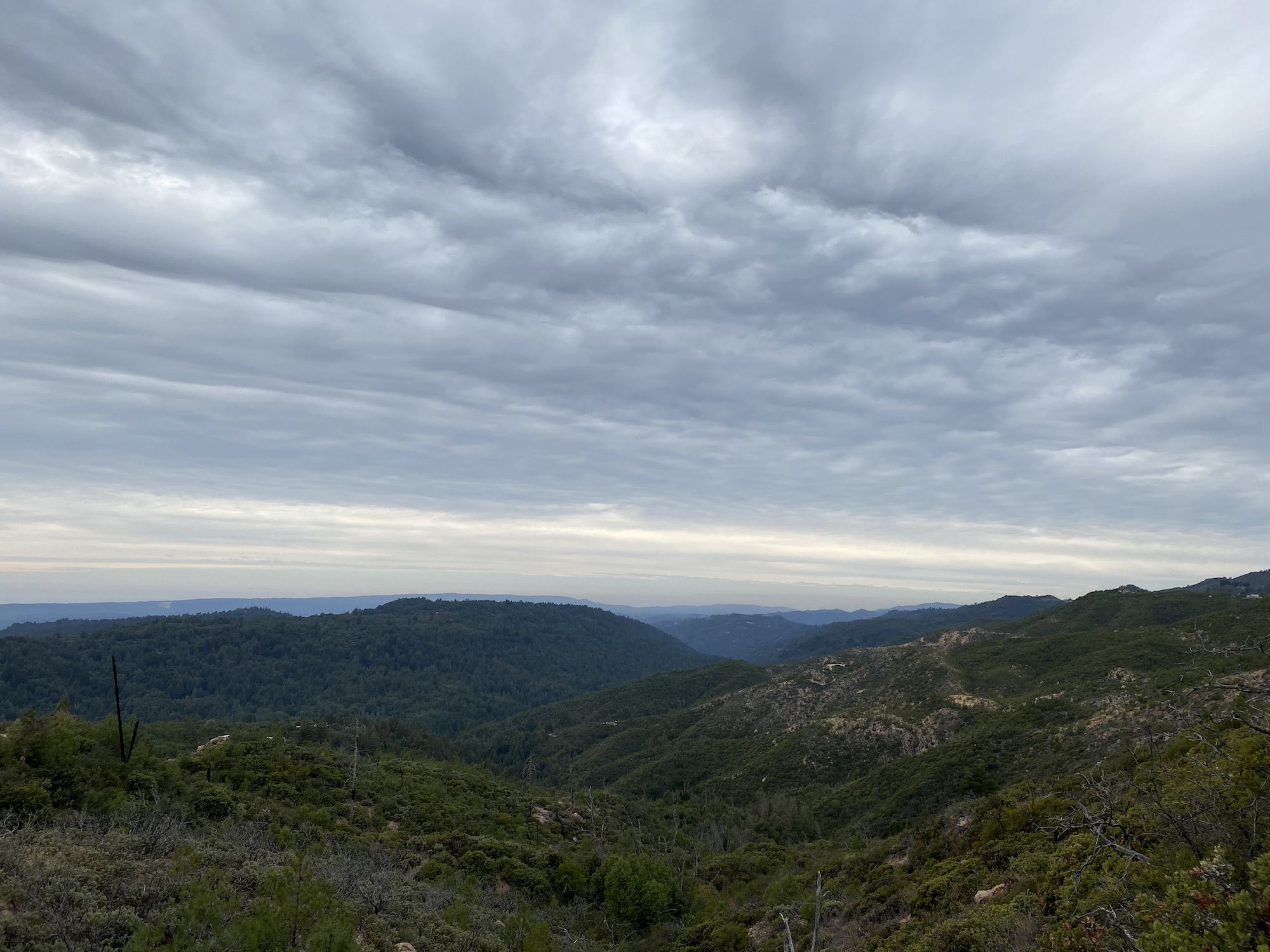 Green hills under a cloudy sky