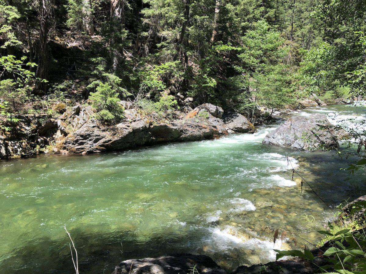 A blue pool in the rushing river.