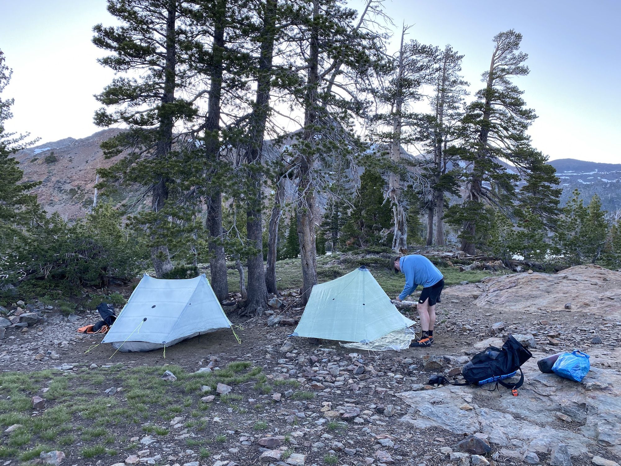 Two tents on rocky ground