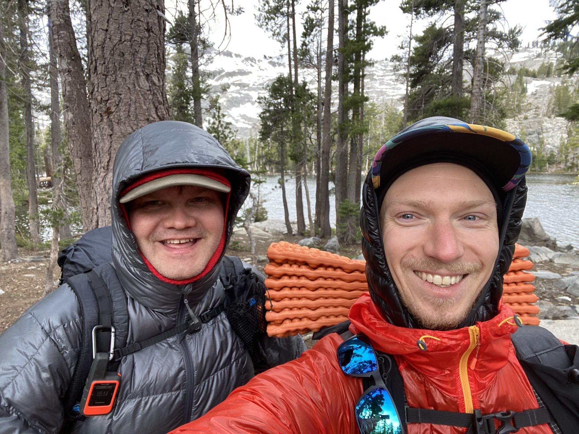 Two hikers with puffy jackets