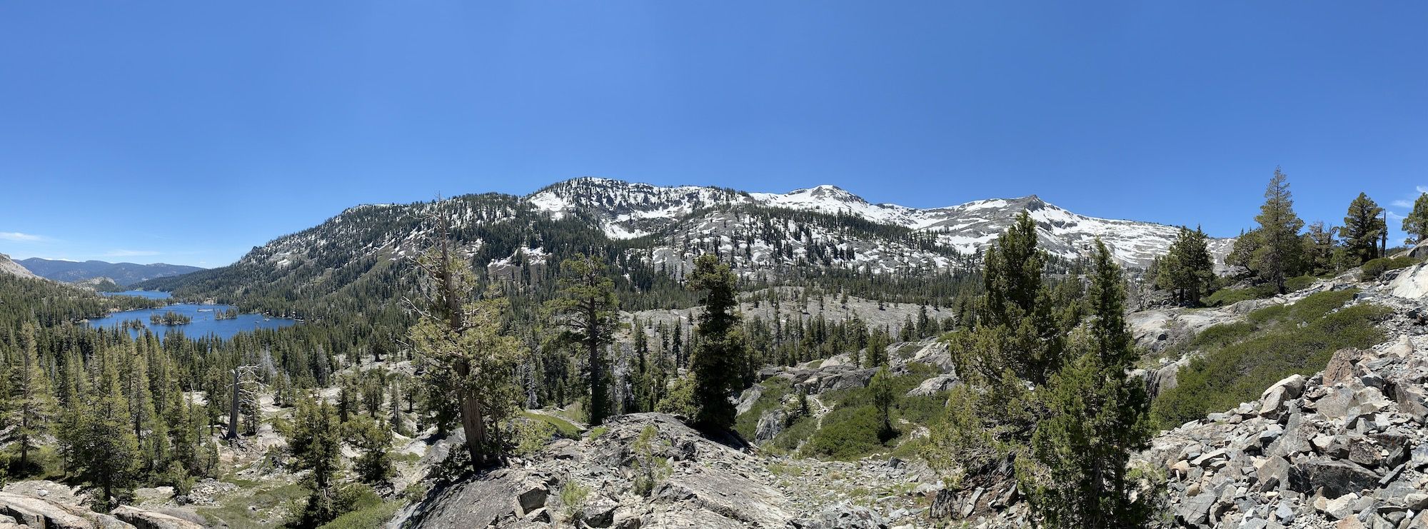 A panorama view of Echo lakes and mountains with snow