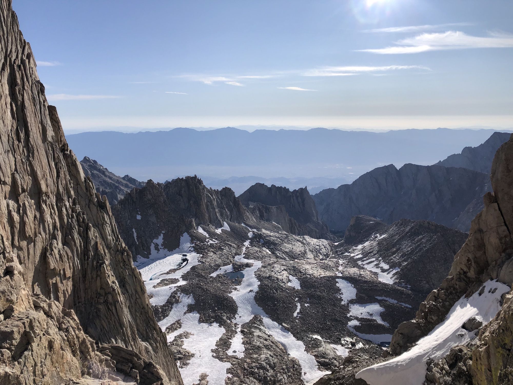 A valley far below the mountains.