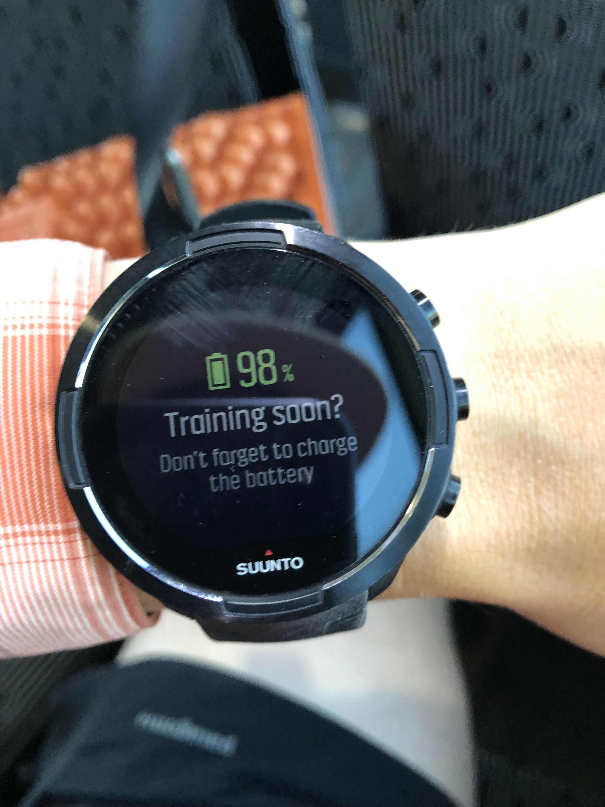 A GPS watch on a wrist.