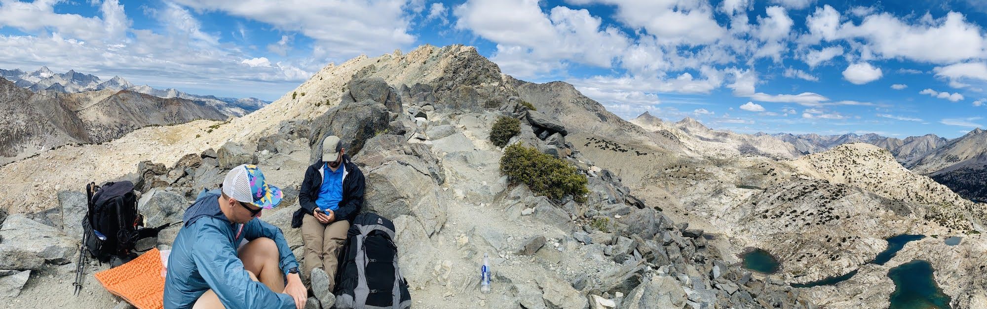 Two backpackers on top of Glenn Pass on the JMT.