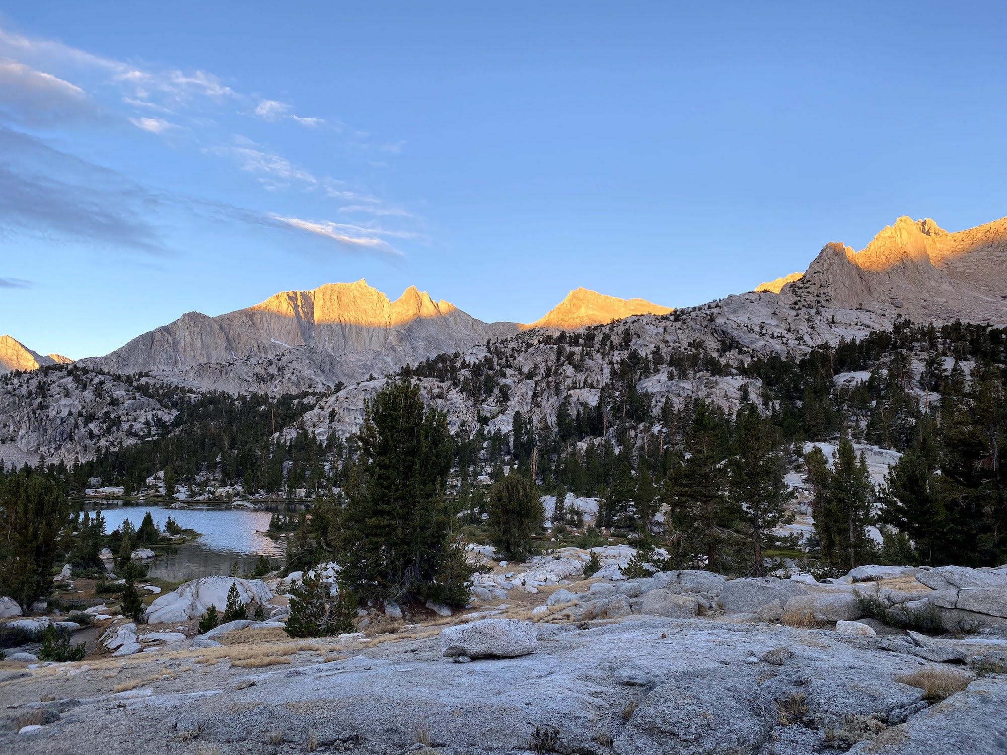 The sun hitting mountain tops in 60 Lakes Basin