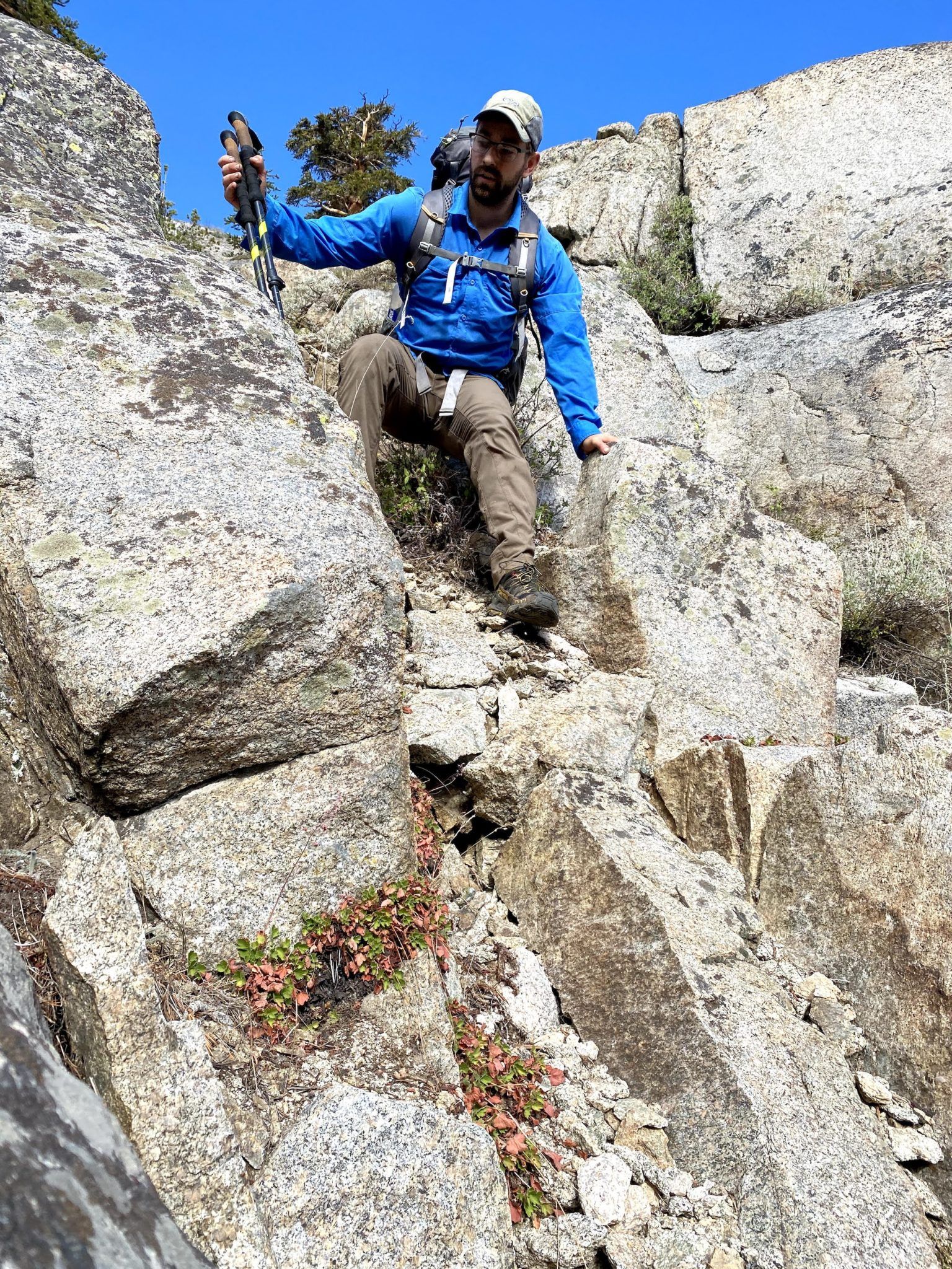 A man climbing down rocks
