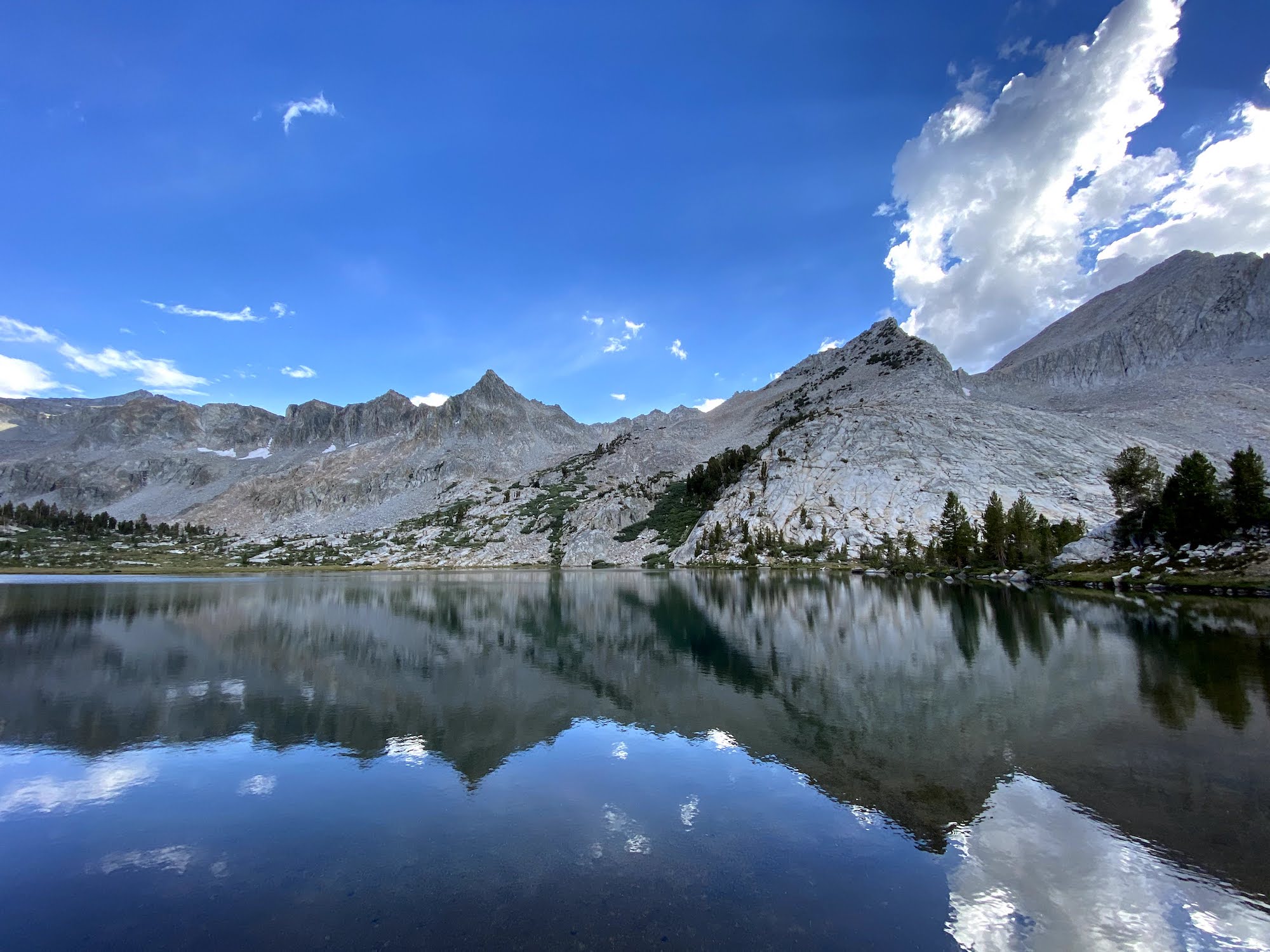 A lake reflecting mountains. 