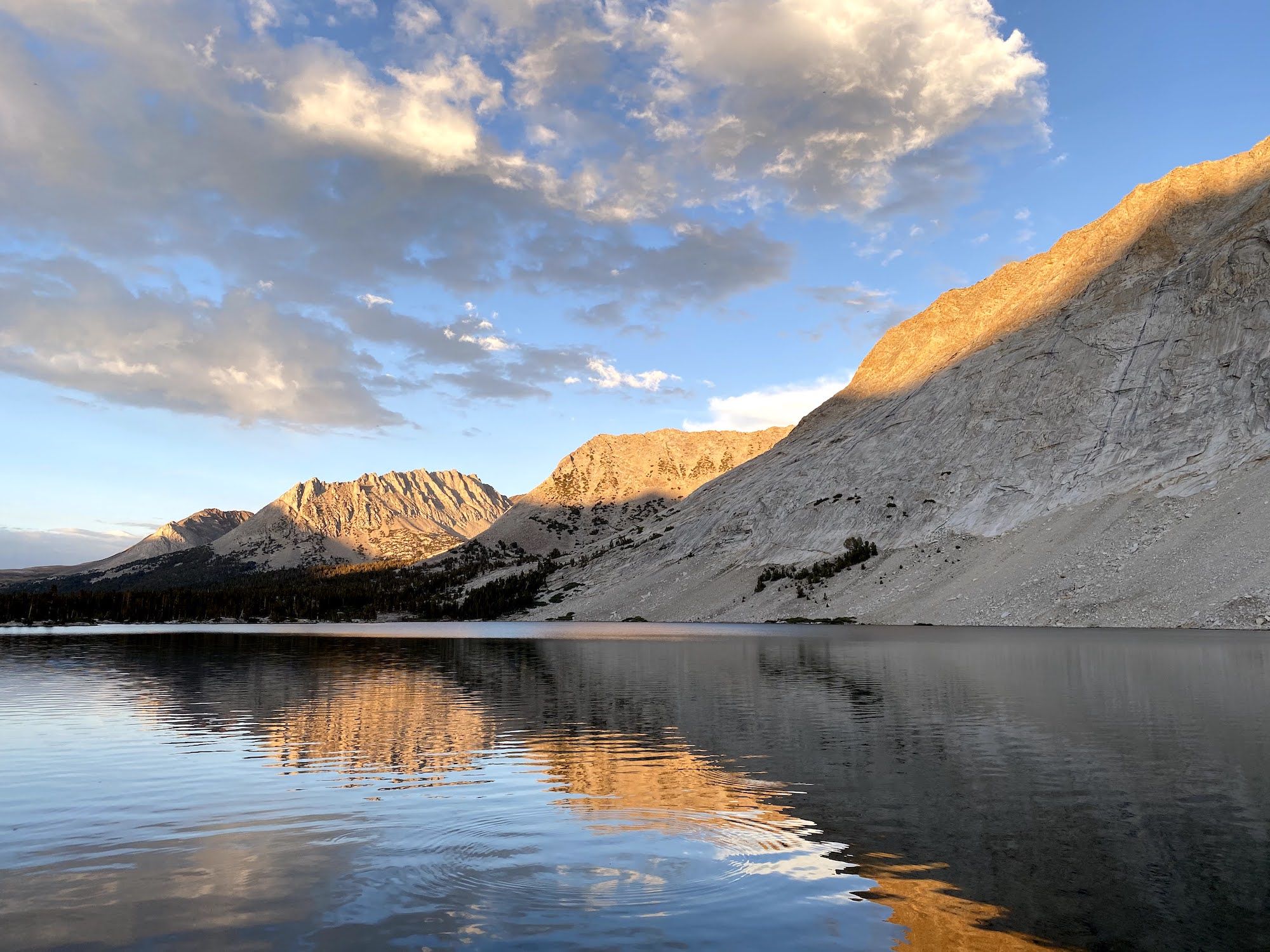 The sunset illuminating the tops of mountains. 