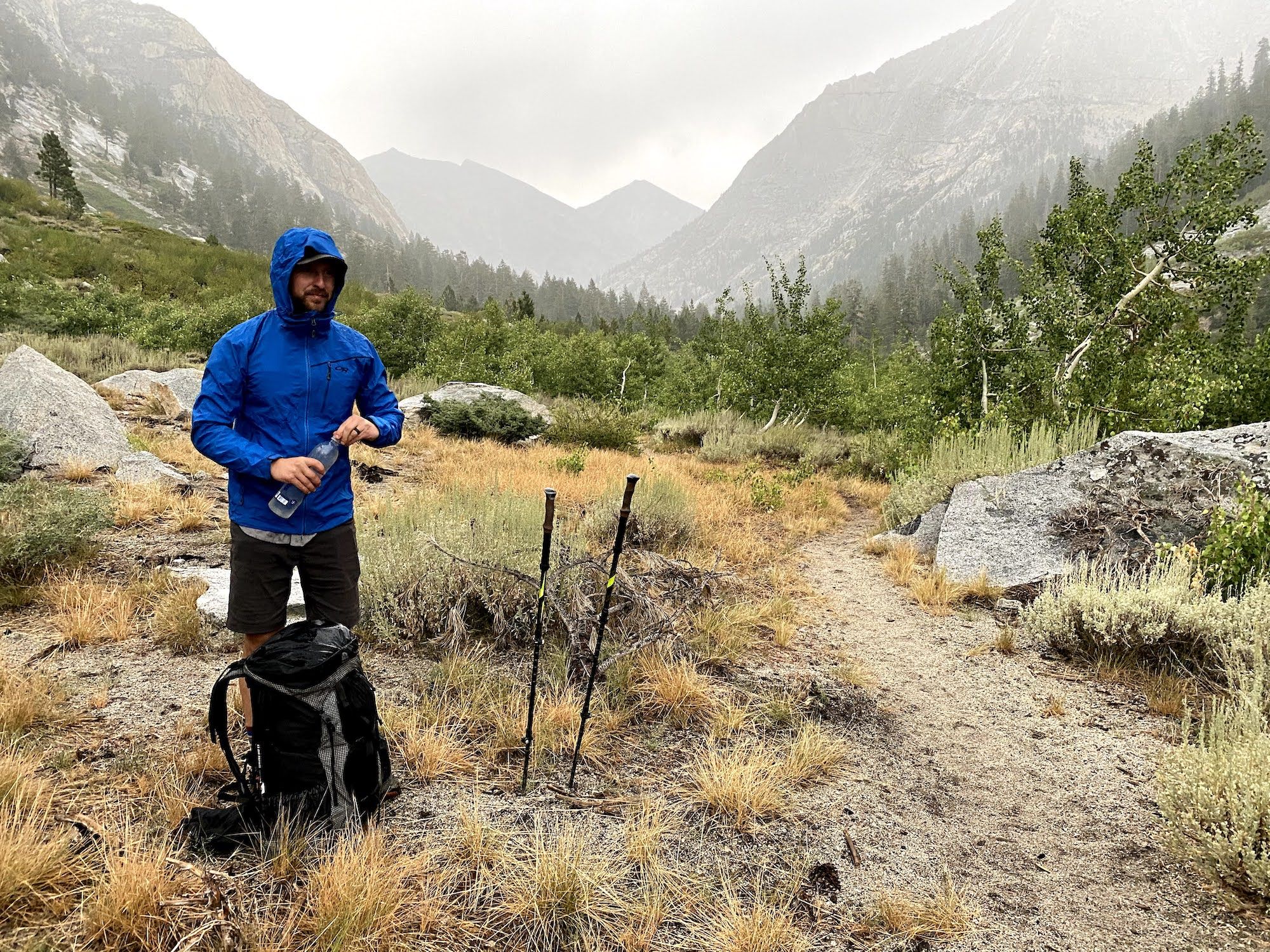 A man standing in rain gear 