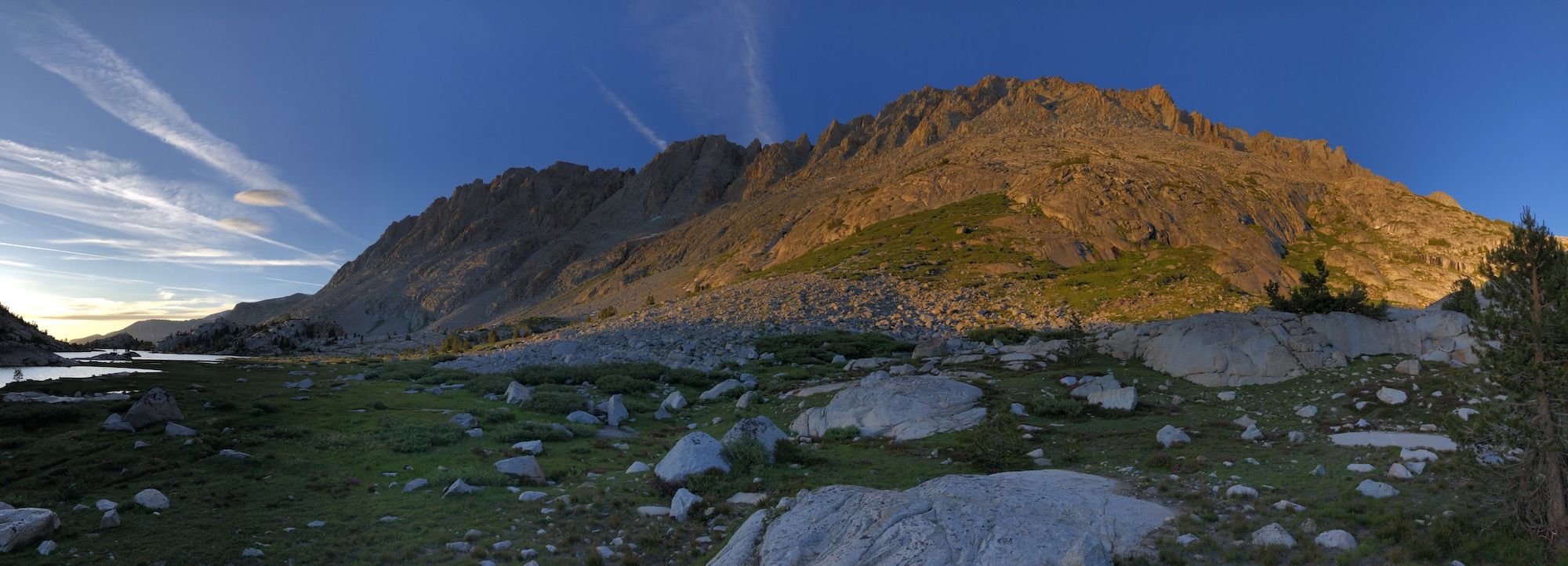 The last rays of sun hitting a mountain wall.