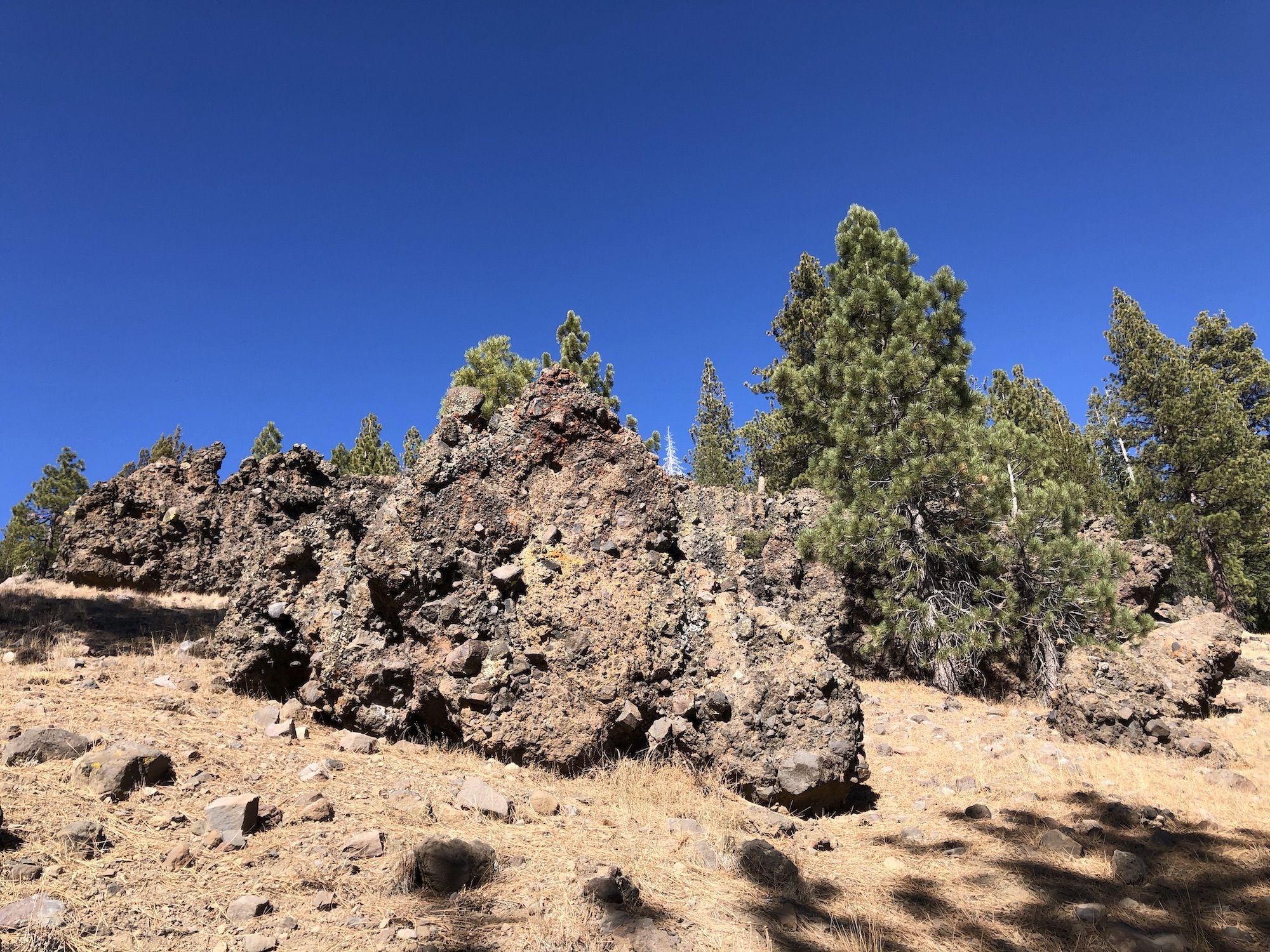 Large boulders of lavarock that has smaller rocks embedded in it.