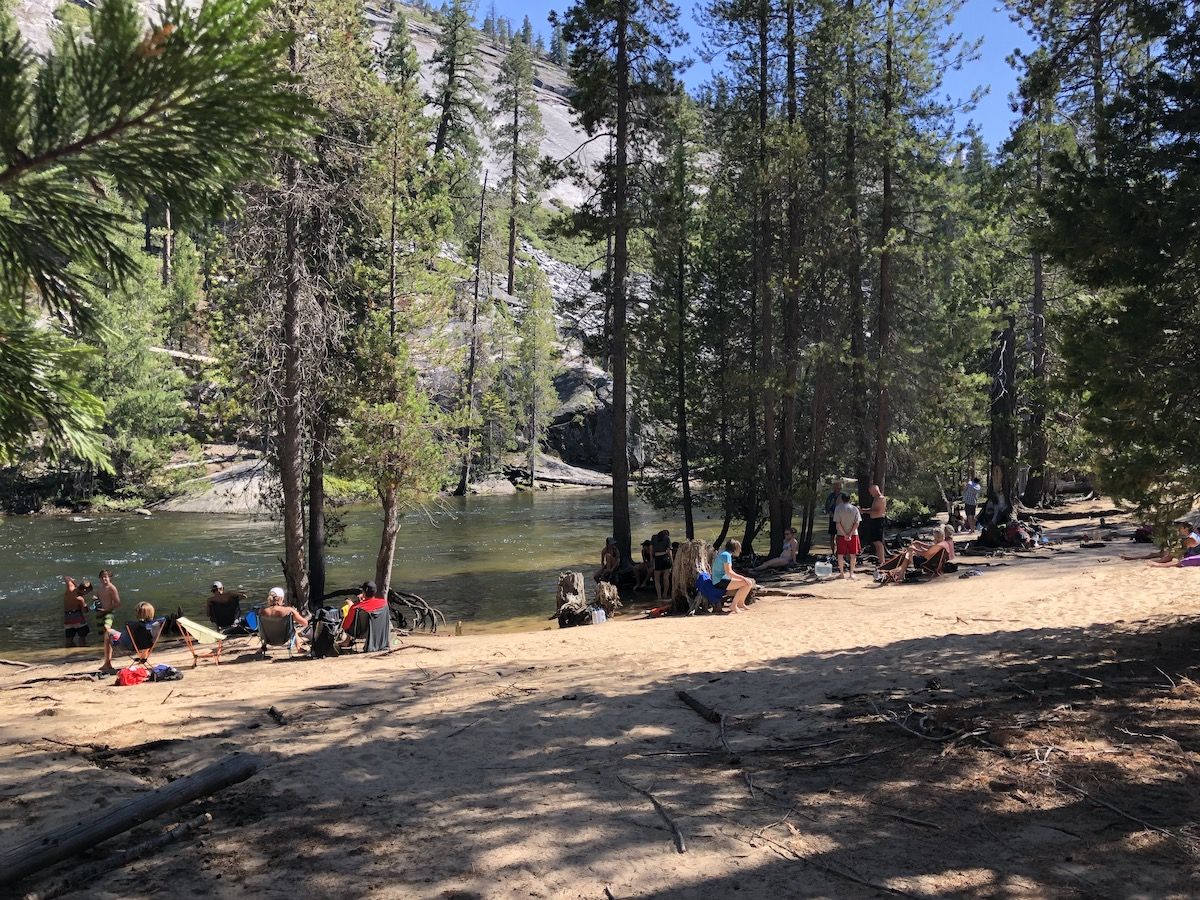 People swimming in Merced River.