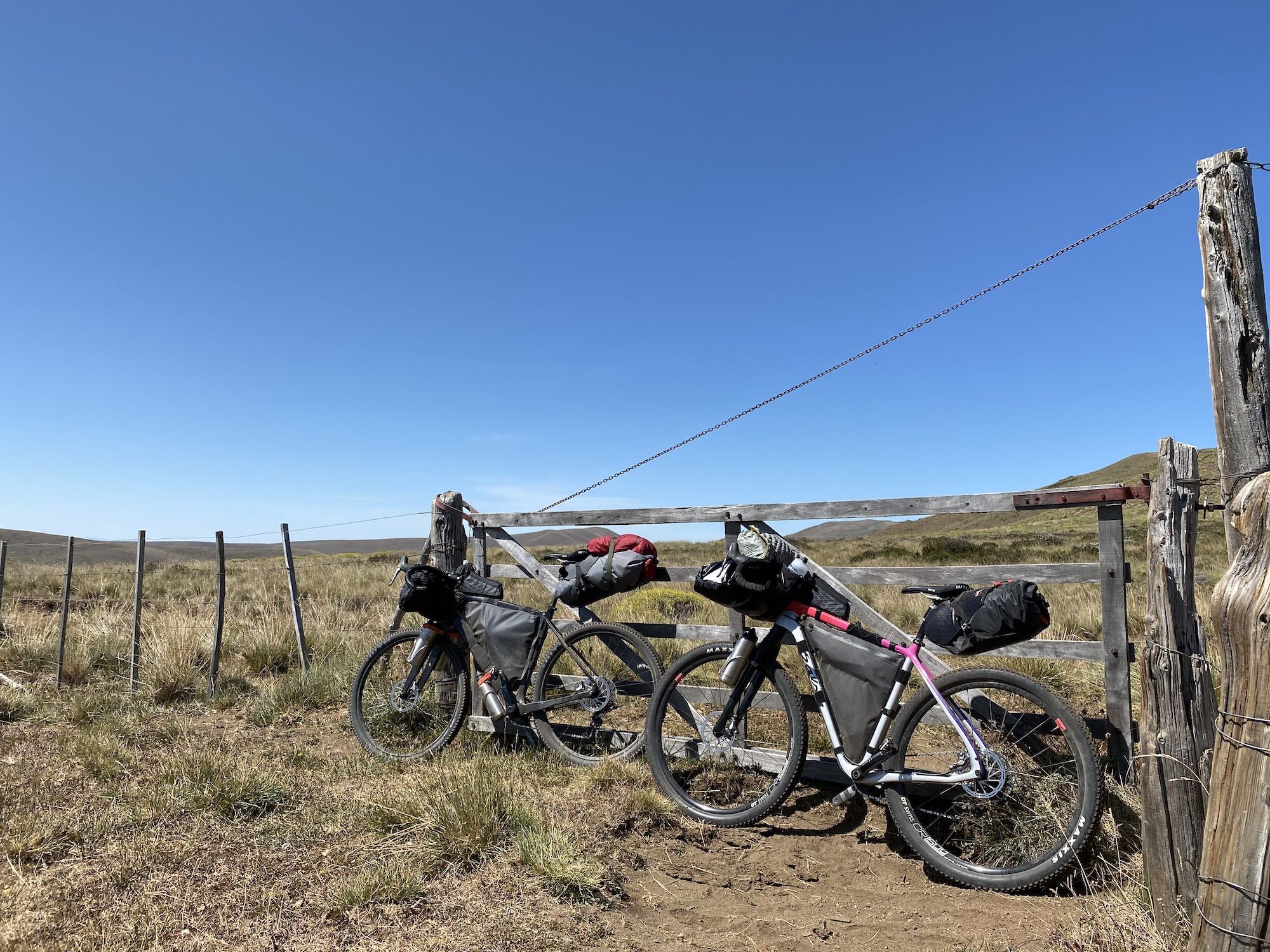 Bikes leaning against a gate