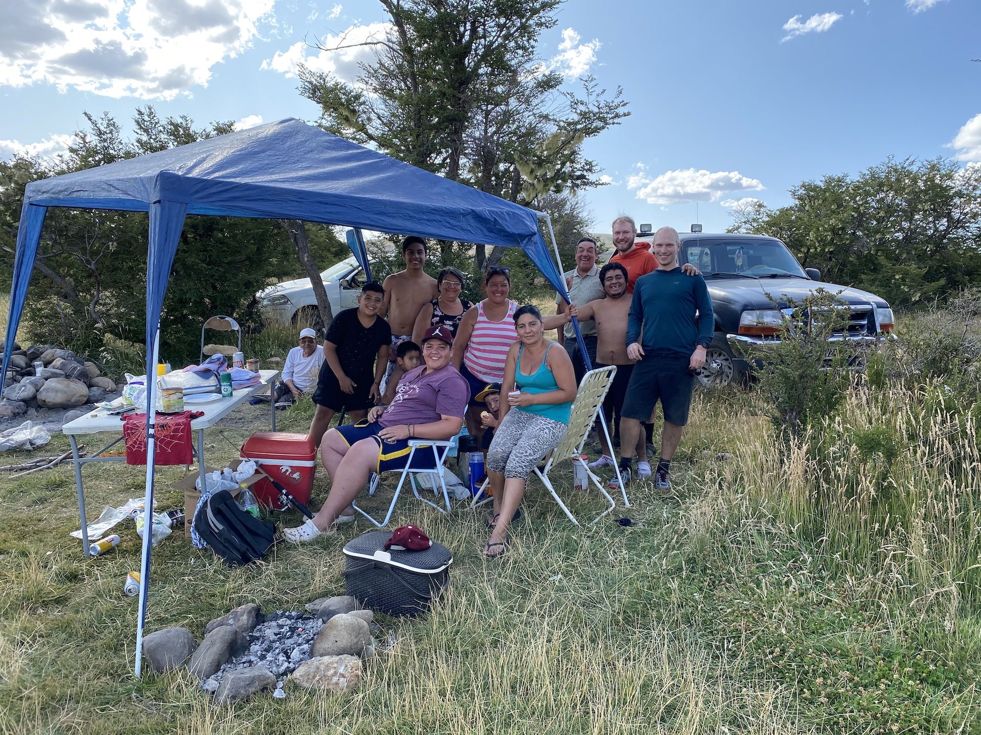 An Argentinian family barbecuing by the river.