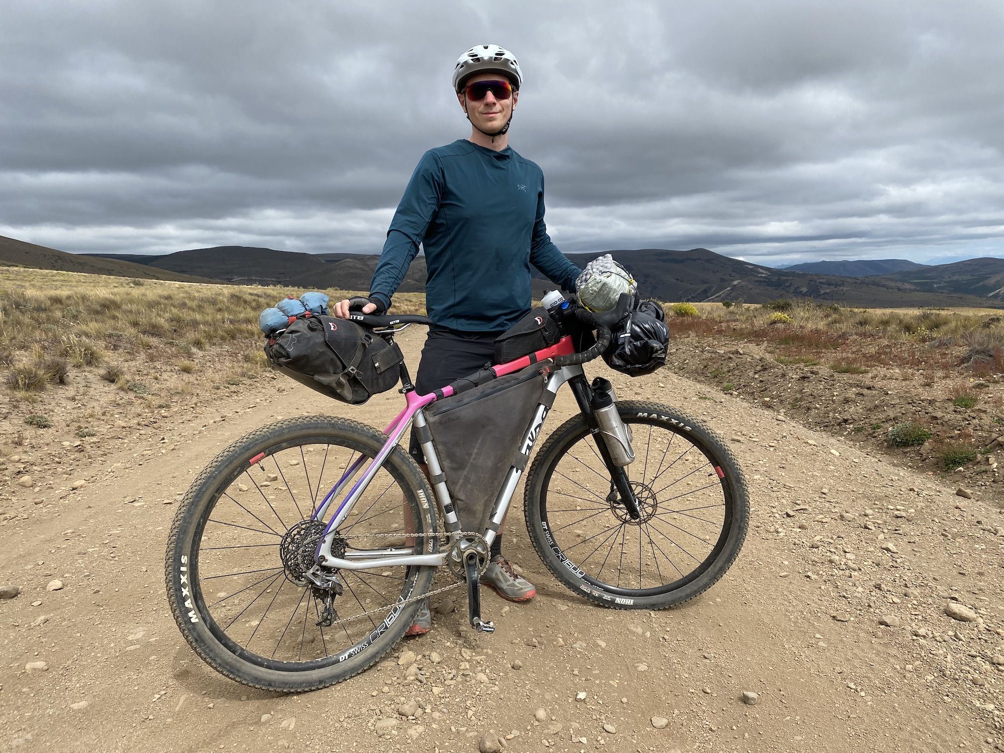 Man posing behind his bike