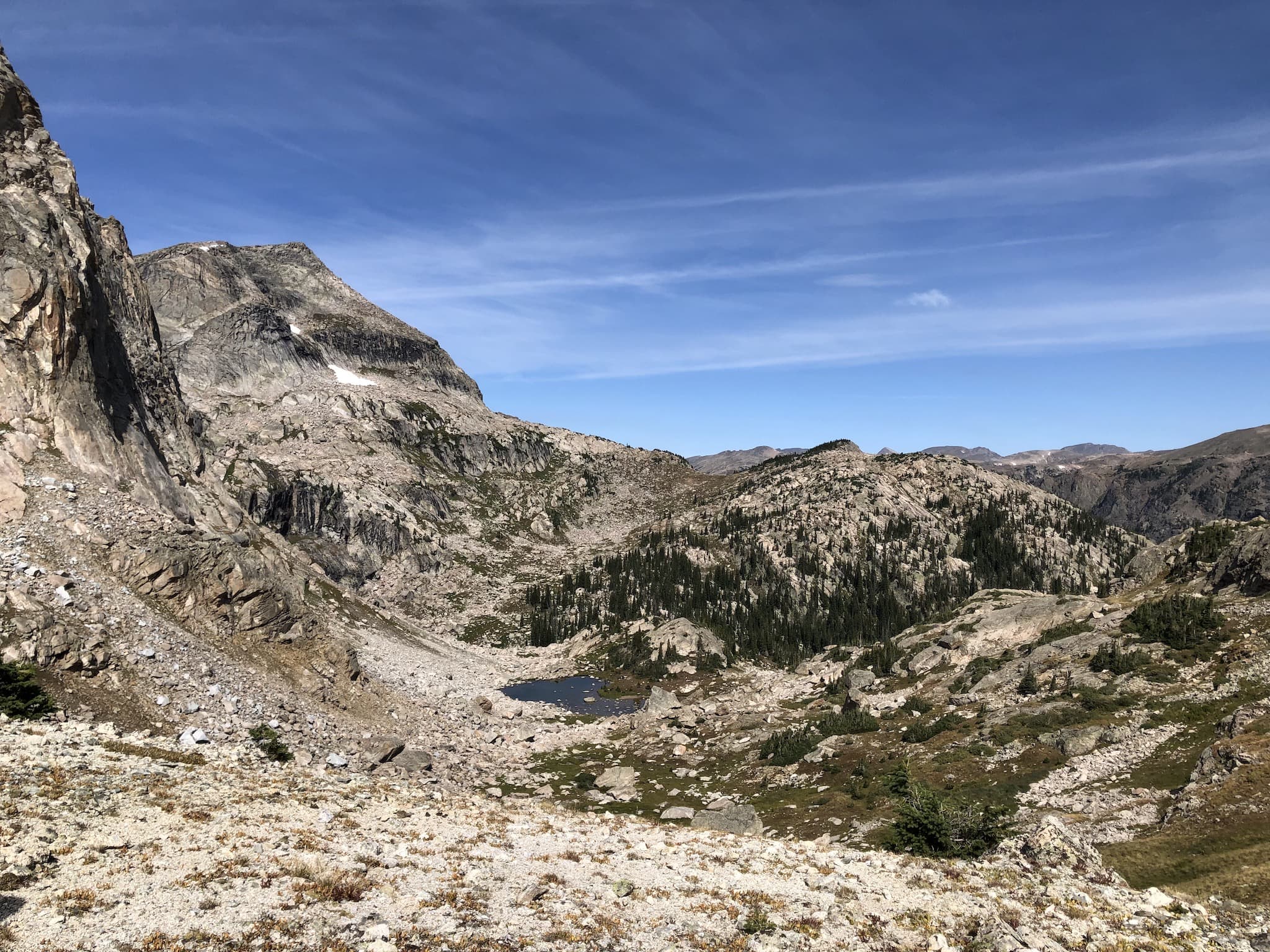 A small lake between two mountain passes.