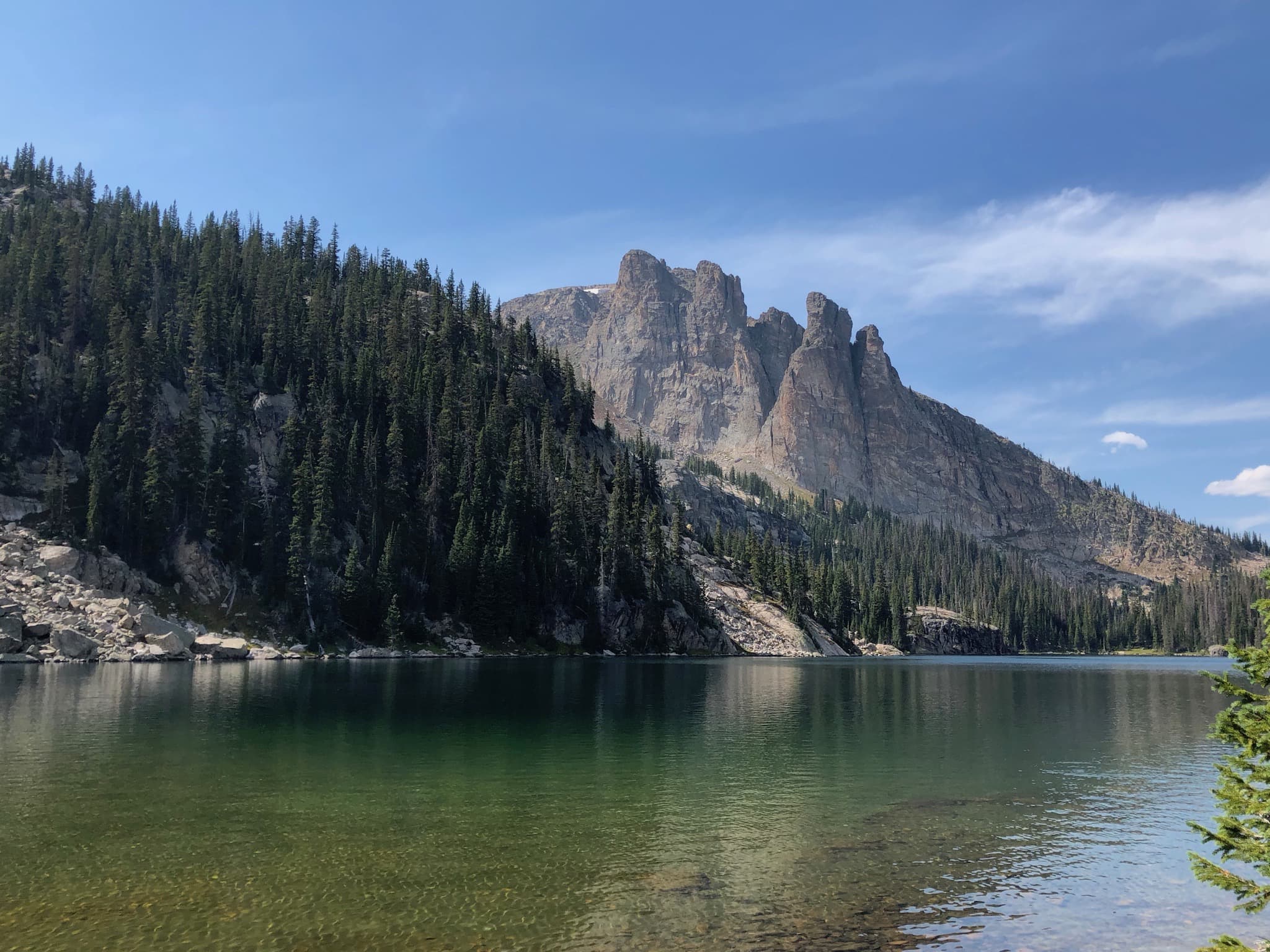 Towering mountains behind a lake