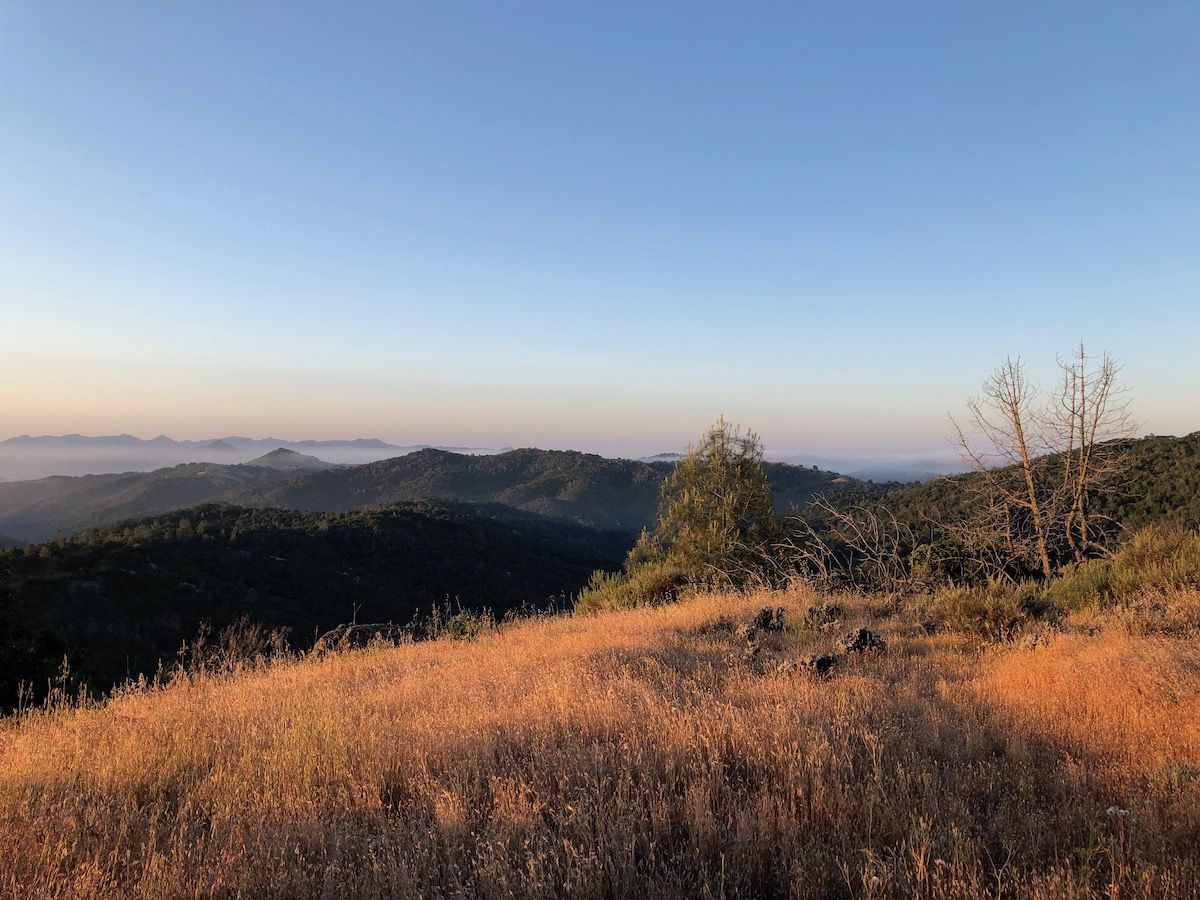 Sunrise at the campsite overlooking a misty valley.