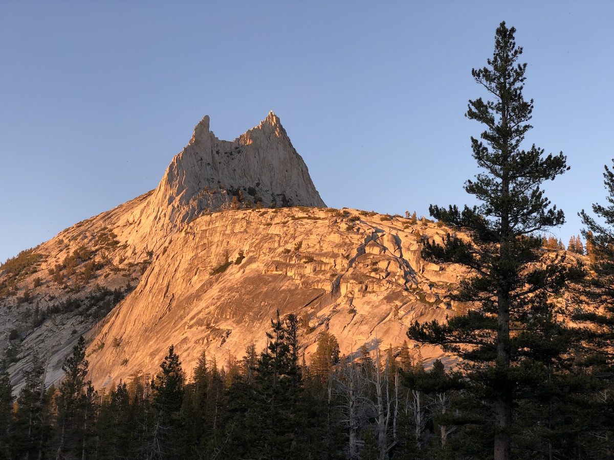 Cathedral Peak illuminated by the sunset.