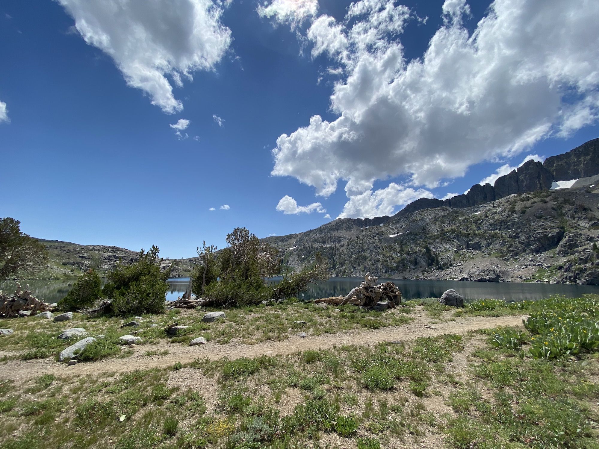 A small lake in front of mountains