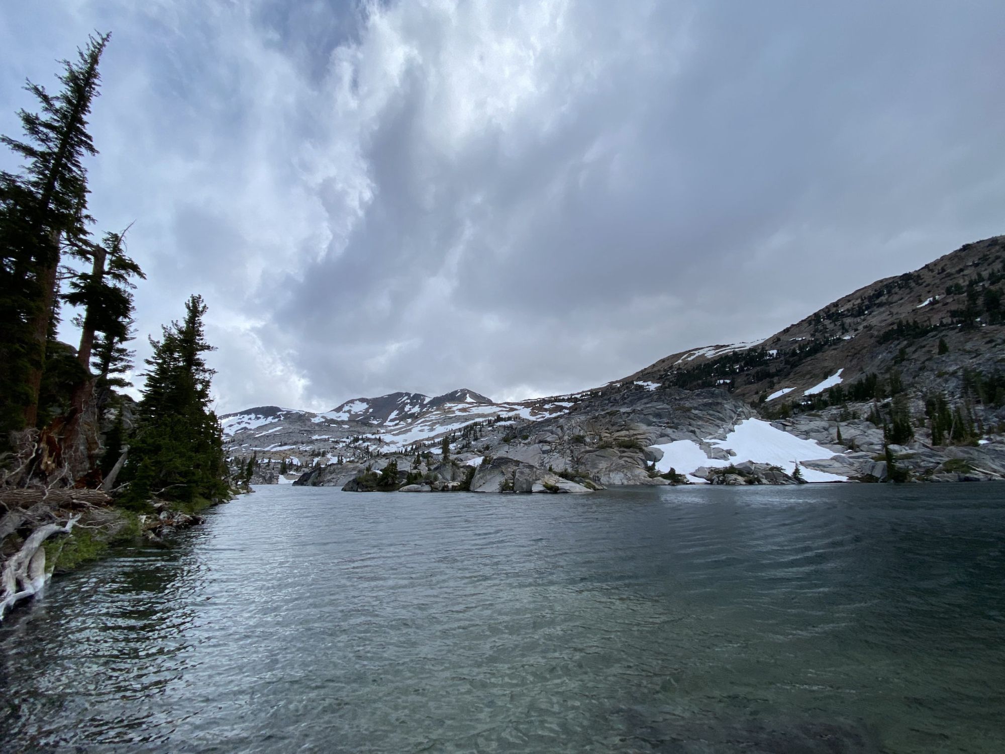 Dark clouds over a mountain lake