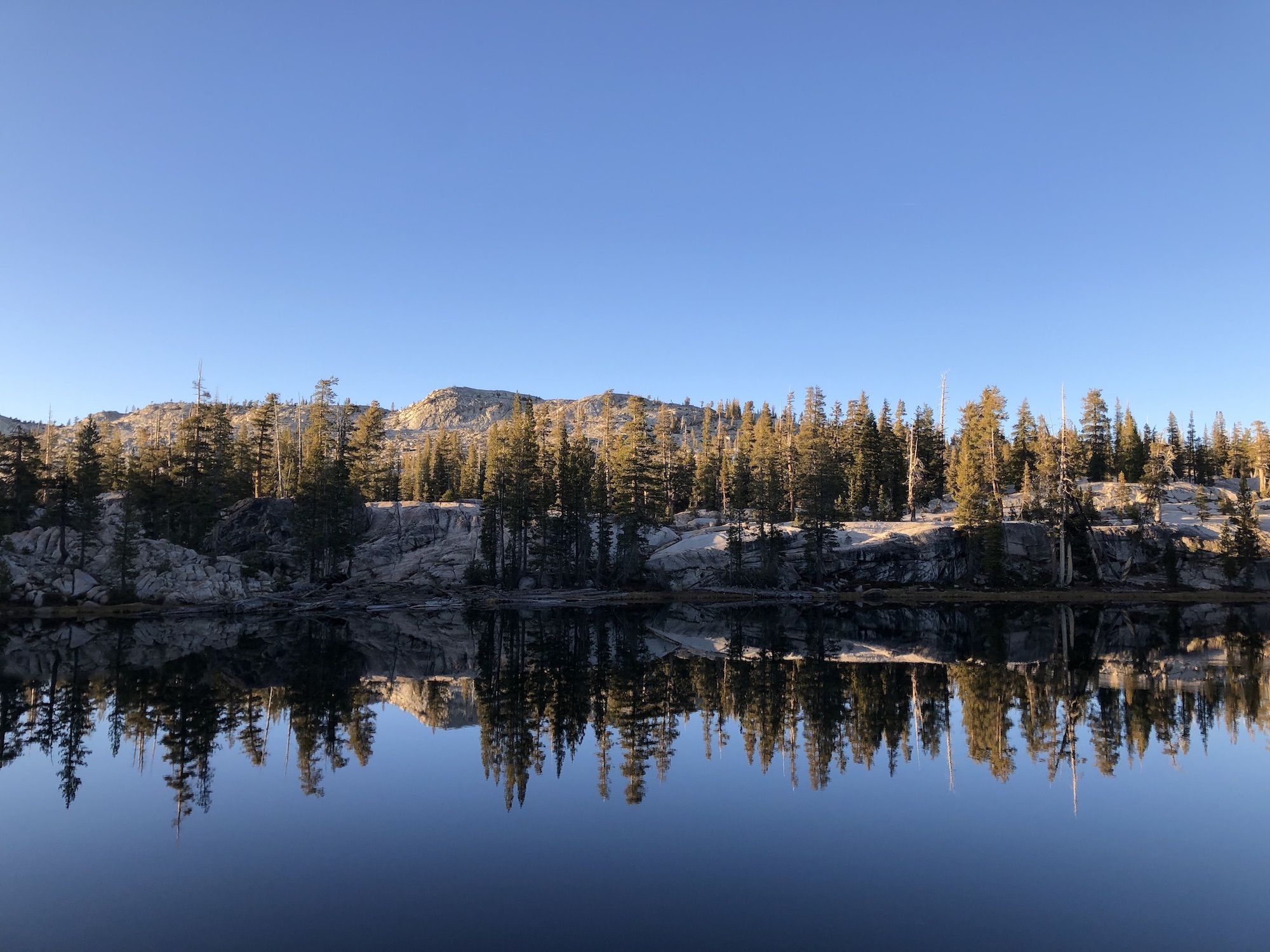 A cliff 30 feet above a lake