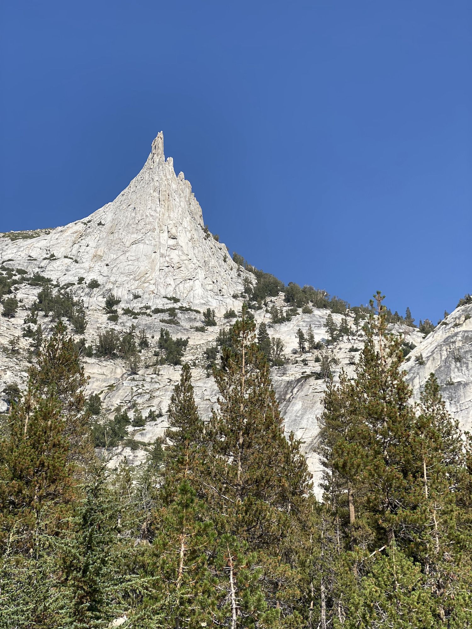 A sharply pointed mountain top.