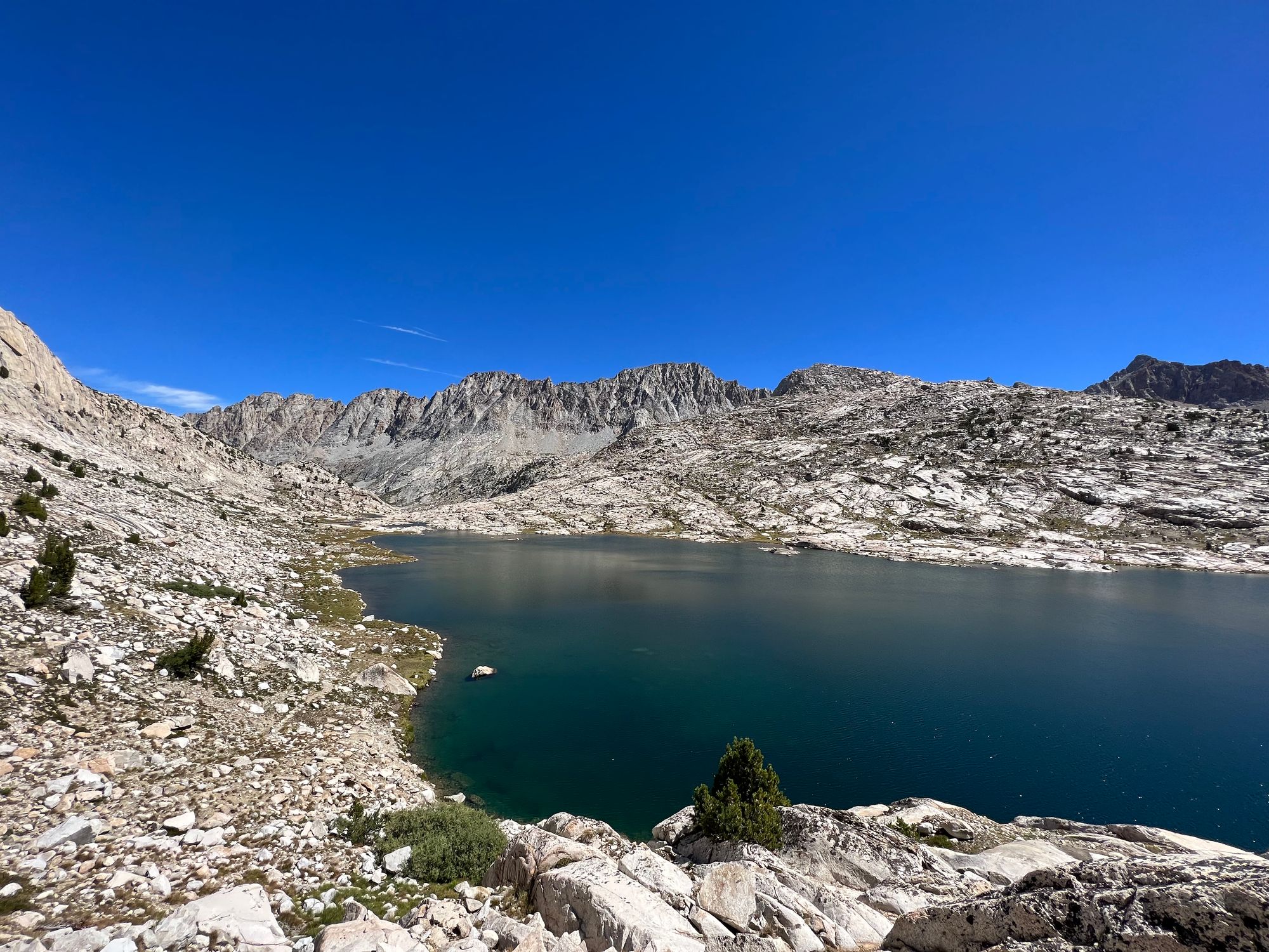 A deep-blue lake surrounded by granite.